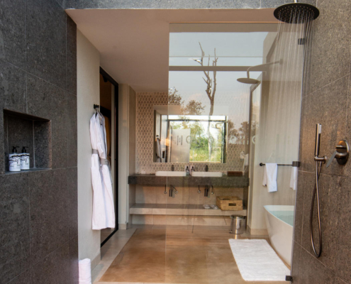 1756383058945idube-game-reserve---linked-suite-graniteindooroutdoorshower Idube Game Lodge